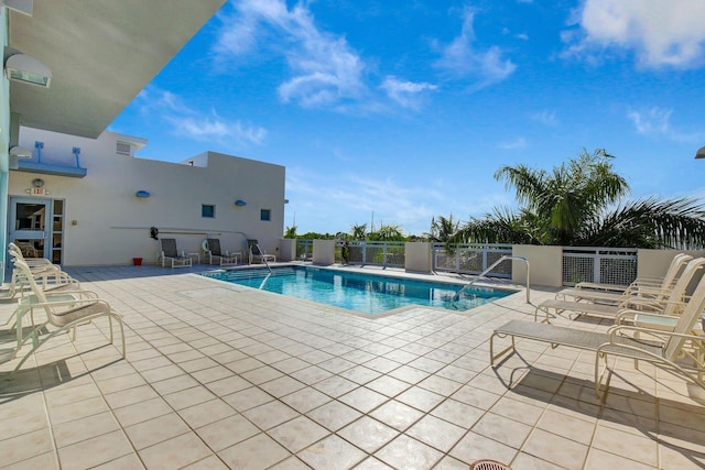 view of swimming pool with a patio