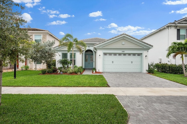 view of front of home with a garage, a front yard, and french doors