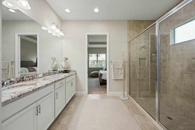 bathroom with tile patterned floors, vanity, and walk in shower