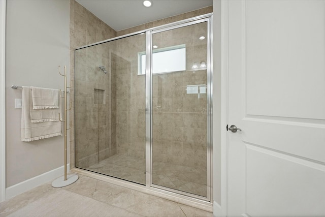 bathroom featuring tile patterned flooring and walk in shower