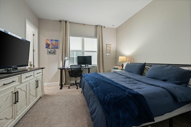 carpeted bedroom featuring lofted ceiling