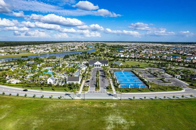 birds eye view of property with a water view