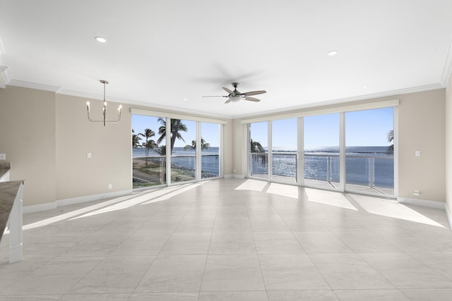 spare room with ceiling fan with notable chandelier, a water view, crown molding, and a wealth of natural light