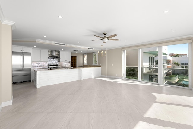 unfurnished living room featuring light tile patterned floors, ceiling fan, and crown molding