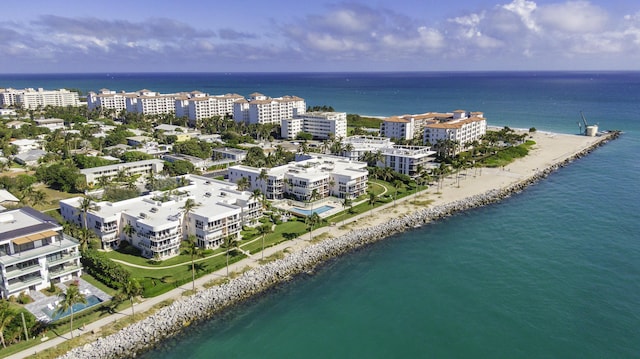 birds eye view of property with a view of the beach and a water view