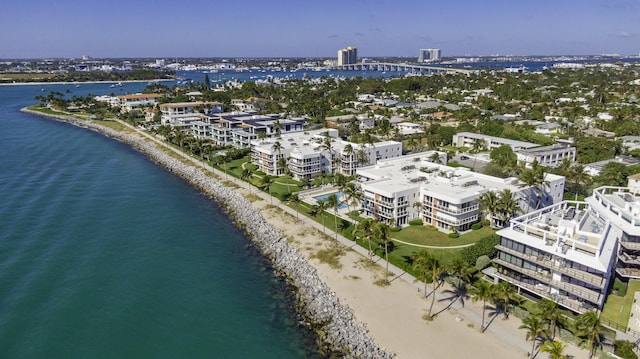 drone / aerial view with a water view and a view of the beach