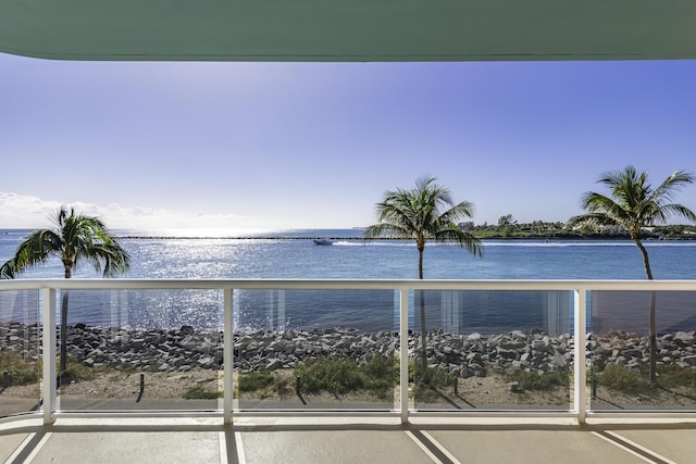 balcony featuring a water view