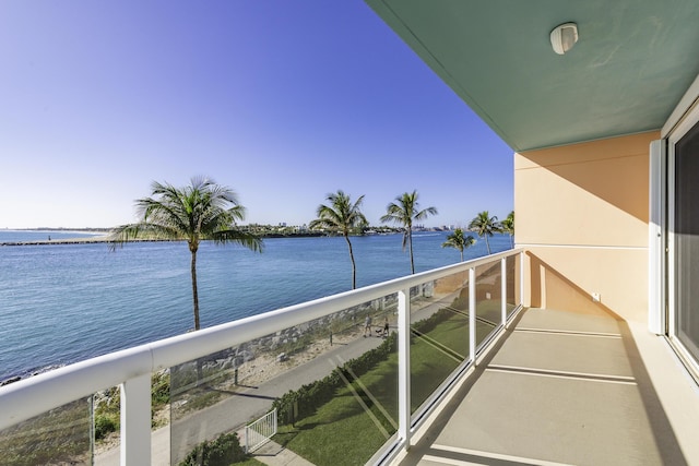 balcony featuring a water view