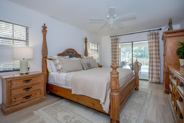 bedroom featuring light wood-style floors, a ceiling fan, and access to exterior