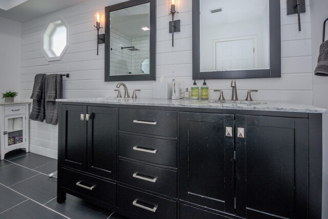 bathroom with vanity, tile patterned floors, and a shower with shower door