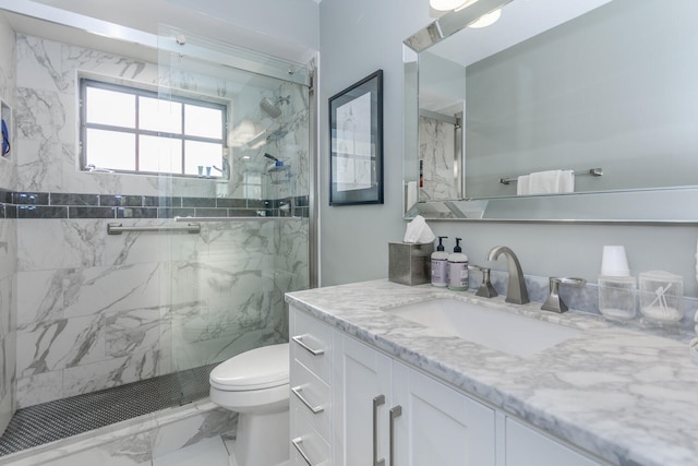 full bath with a marble finish shower, marble finish floor, and toilet