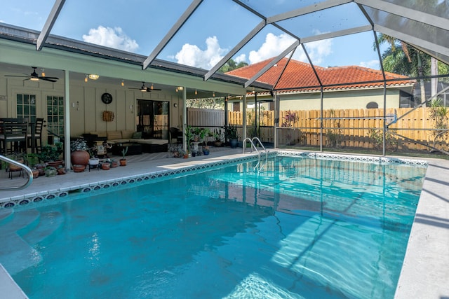 view of pool featuring a patio, a ceiling fan, an outdoor living space, a fenced backyard, and a fenced in pool