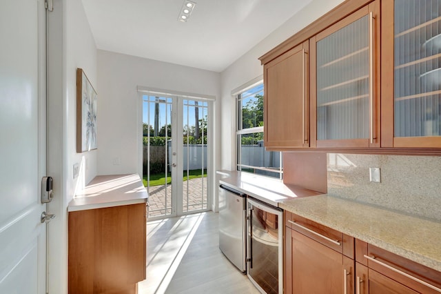 interior space featuring french doors, wine cooler, and light hardwood / wood-style flooring