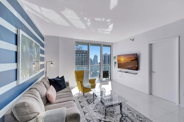 living room with light tile patterned floors and a wall of windows