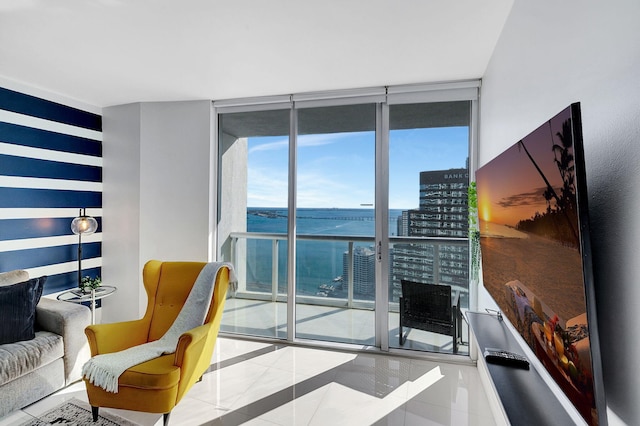 living room featuring floor to ceiling windows and tile patterned flooring