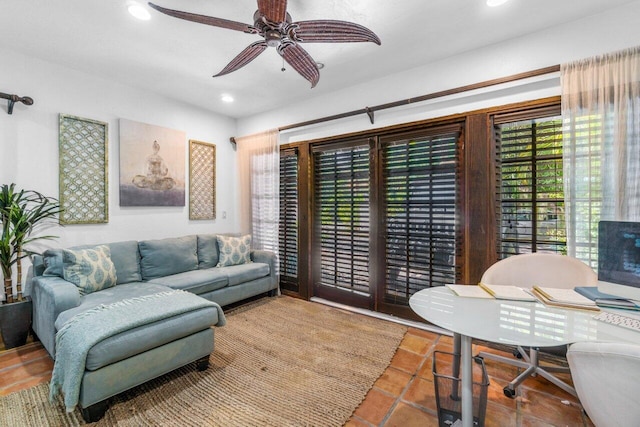 living room featuring tile patterned floors and ceiling fan