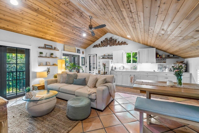 tiled living room with ceiling fan, wood ceiling, and high vaulted ceiling