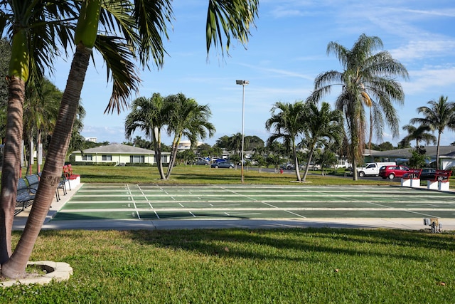 view of community featuring a yard