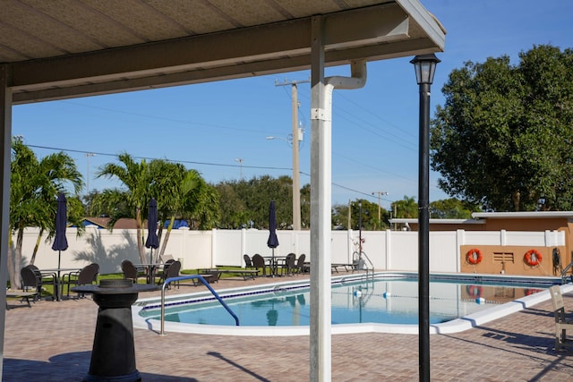 view of pool featuring a patio