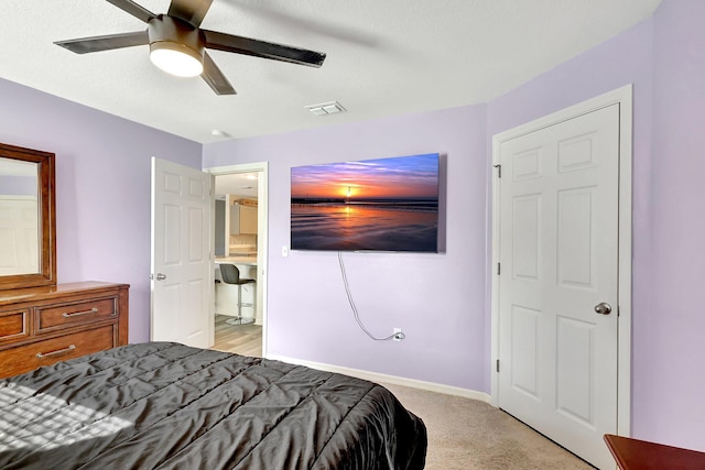 carpeted bedroom featuring ceiling fan