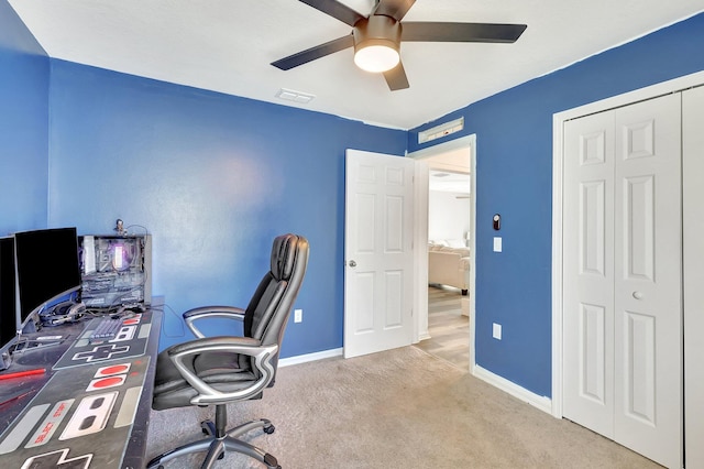 office area with carpet floors and ceiling fan