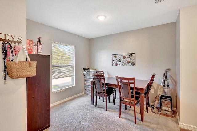 dining area with carpet