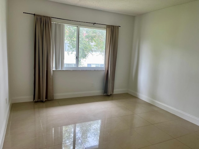 view of tiled spare room