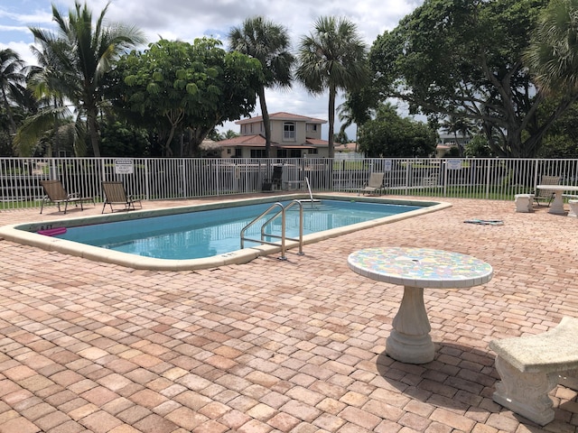 view of swimming pool featuring a patio