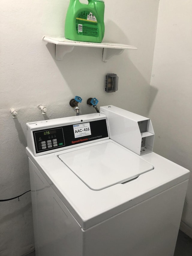 clothes washing area featuring washer and dryer