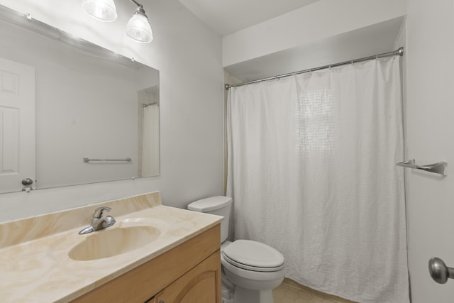 bathroom featuring tile patterned flooring, vanity, and toilet