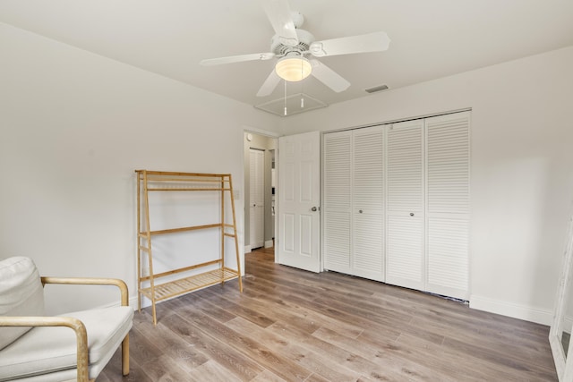 unfurnished room with hardwood / wood-style flooring and ceiling fan