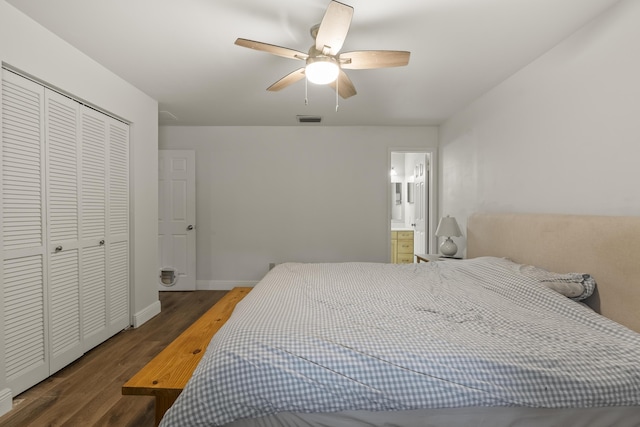 bedroom featuring ensuite bath, ceiling fan, a closet, and dark hardwood / wood-style flooring