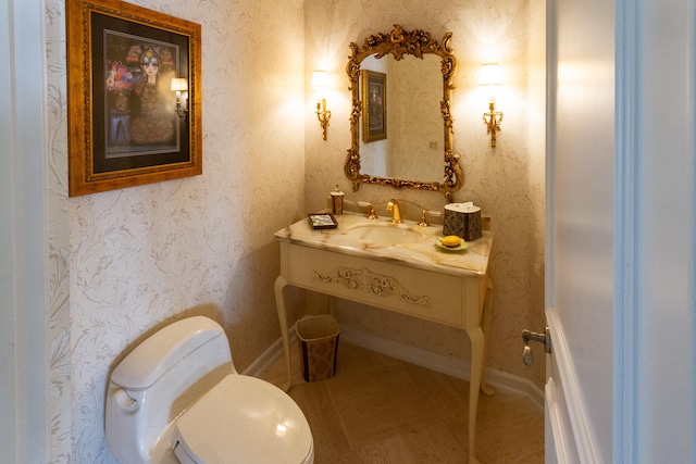 bathroom featuring tile patterned floors, vanity, and toilet