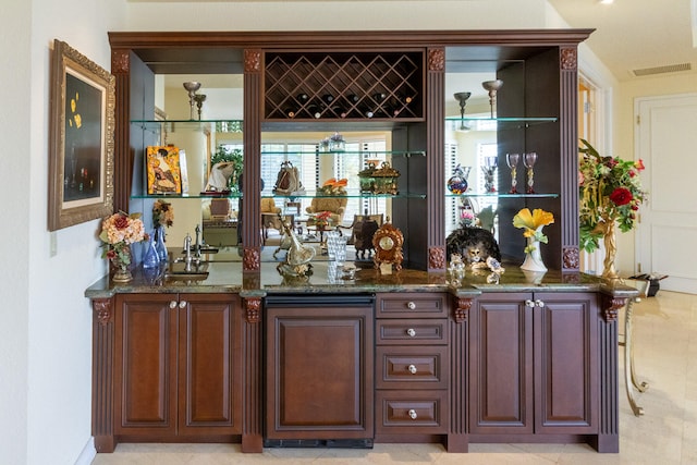 bar with dark stone countertops