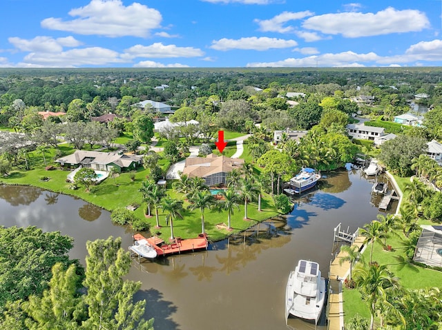 birds eye view of property with a water view