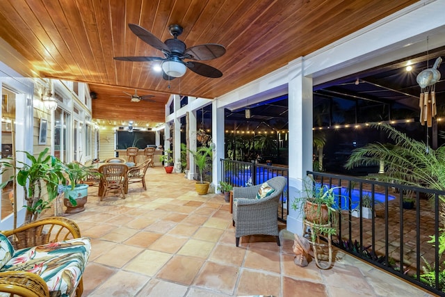 view of patio featuring ceiling fan