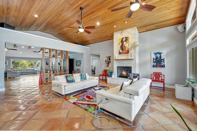 living room featuring a fireplace, high vaulted ceiling, wood ceiling, and light tile patterned floors