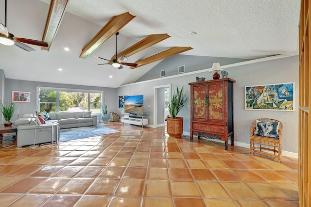 living room with tile patterned floors, ceiling fan, and beamed ceiling