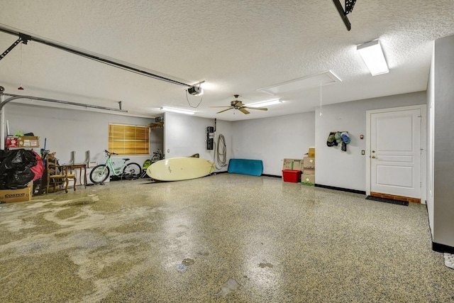 garage featuring ceiling fan and a garage door opener