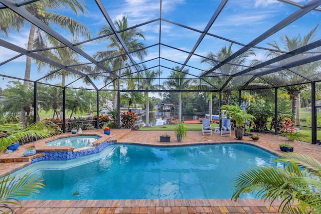 view of pool featuring an in ground hot tub, a patio, a water view, and a lanai