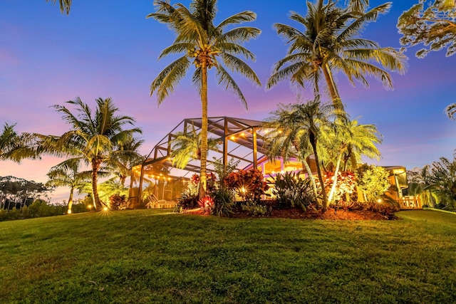 yard at dusk with a lanai