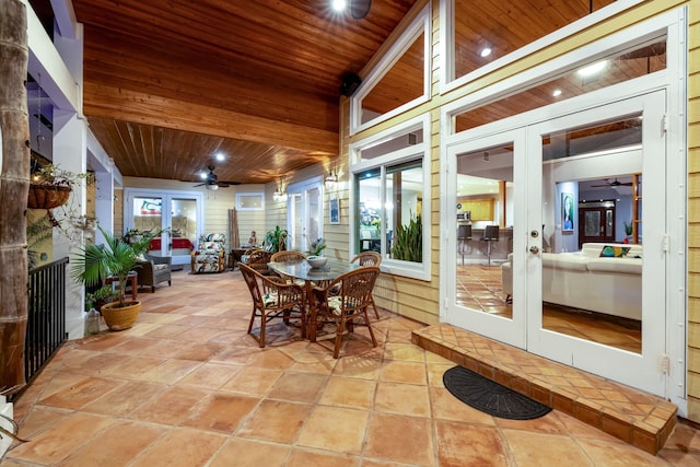 sunroom / solarium with french doors, ceiling fan, and wooden ceiling