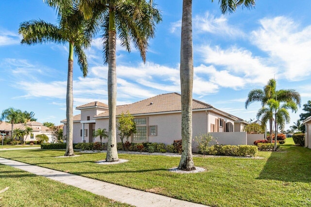 view of side of home with a yard