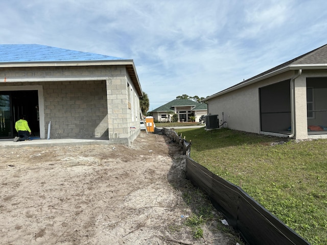 exterior space featuring central AC unit