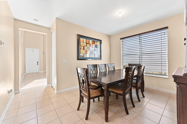 dining space with light tile patterned floors