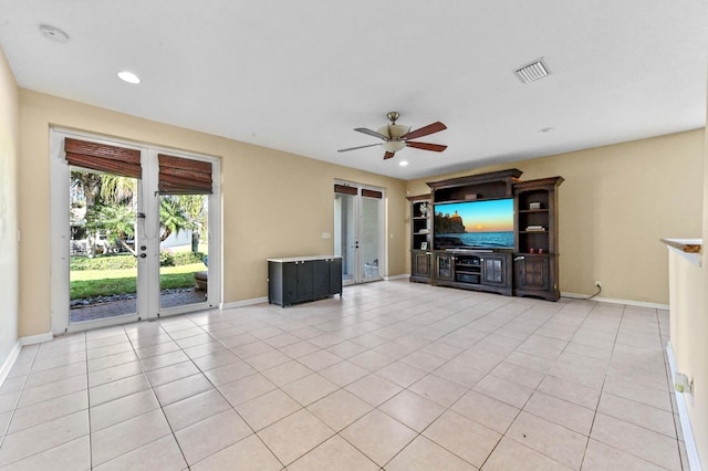 unfurnished living room featuring light tile patterned floors, french doors, and ceiling fan