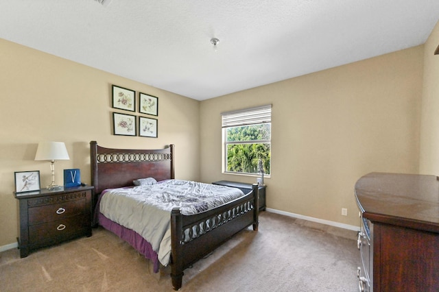 bedroom with light carpet