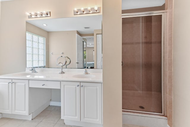 bathroom with vanity, tile patterned floors, and an enclosed shower