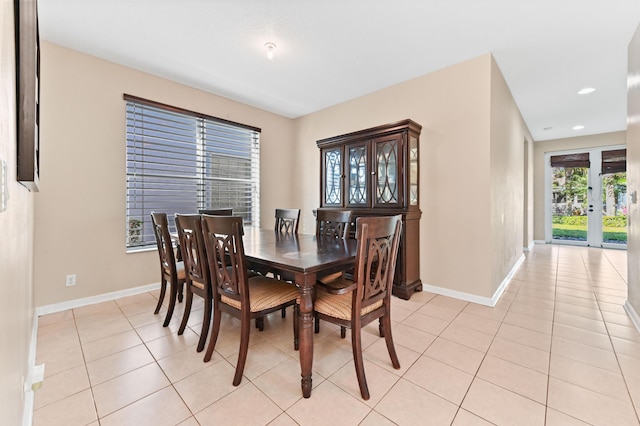 dining area with light tile patterned flooring