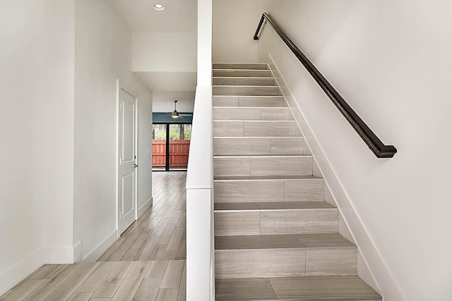 stairs with ceiling fan